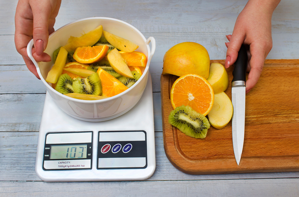 Sliced fruits on weighing scales